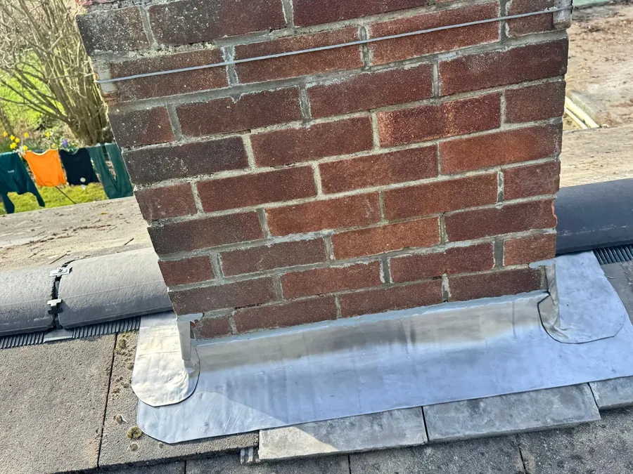 New lead flashing to a chimney by Big Red Roofing