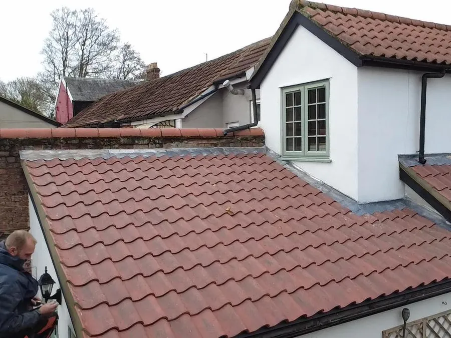 Roof repair in progress by Big Red Roofing