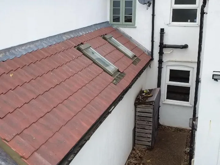 Two roof windows set into a tiled lean-to roof on a Big Red Roofing job